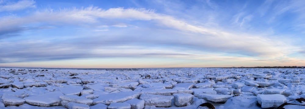 Ice forms on the shores of Hudson Bay as sunset starts to light up the clouds Churchill Manitoba Canada Canvas Art - Robert Postma Design Pics (44 x 15)