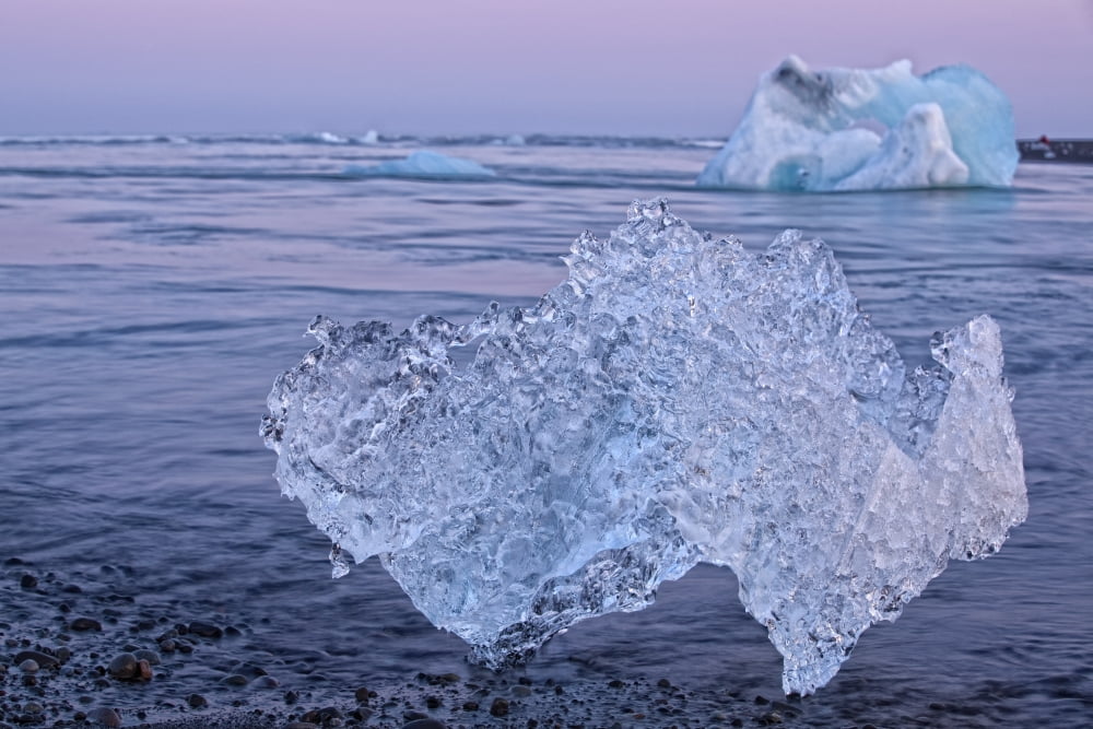 Icebergs on the shoreline of the Atlantic Ocean Iceland Canvas Art - Robert Postma Design Pics (34 x 22)