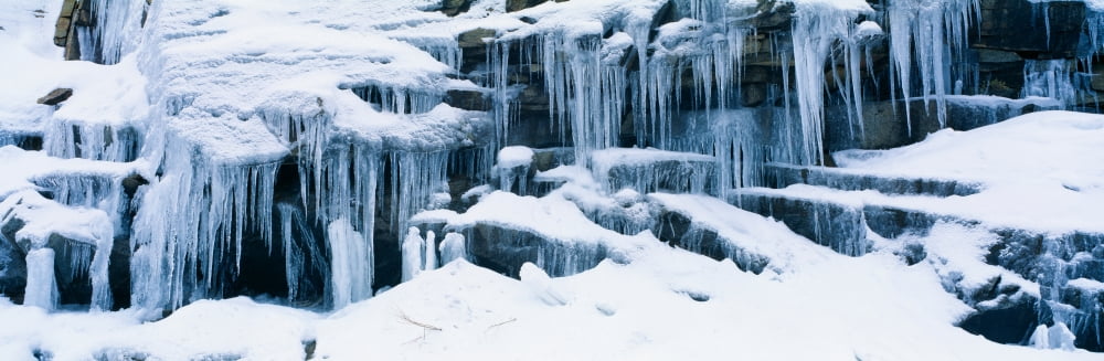 Icicles and snowy rocks in Sierra Nevada Mountains California Canvas Art - Panoramic Images (36 x 12)