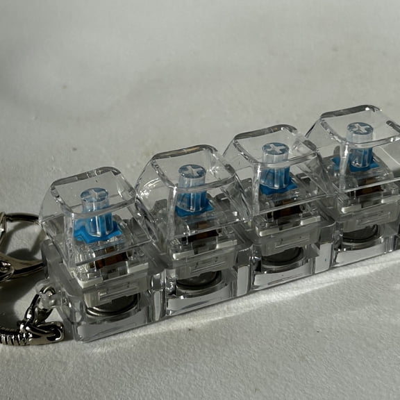 Illuminated Keyboard Squishy, Clear Switch Simulation, Glow-in-Dark Keycaps, Stress Relief for Gamers & Office Workers, Backpack Charm Included