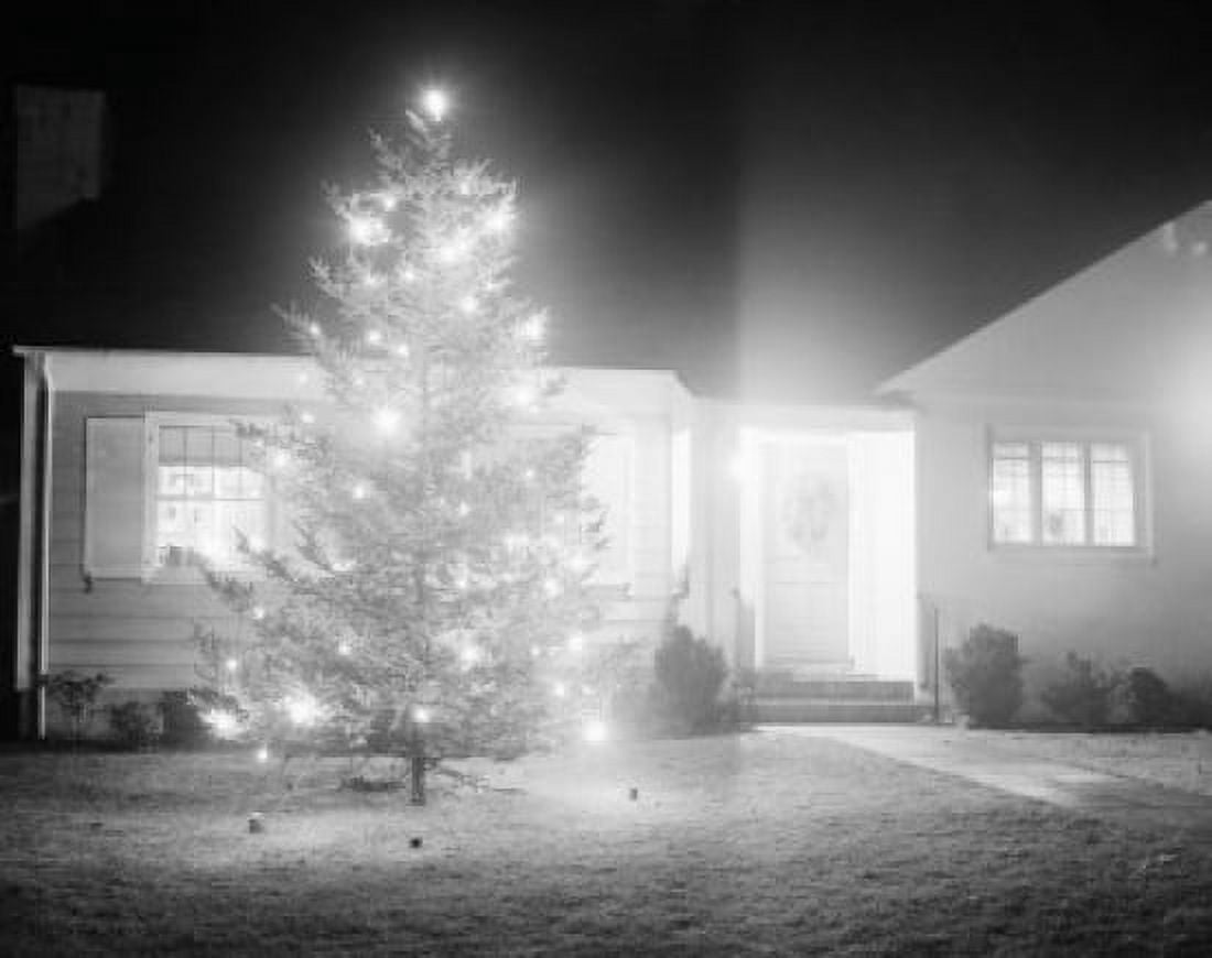 Illuminated christmas tree outside suburban home Canvas Art - (18 x 24)