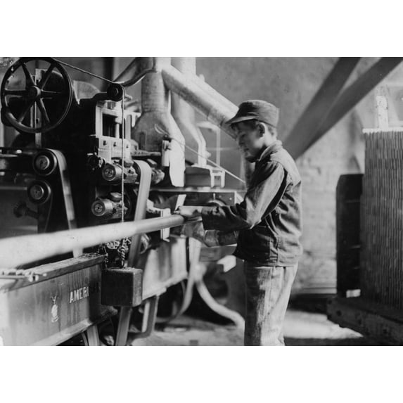 Indiana Mfg. Co., Boy taking boards away from "double cut-off" machine. Poster Print (24 x 36)