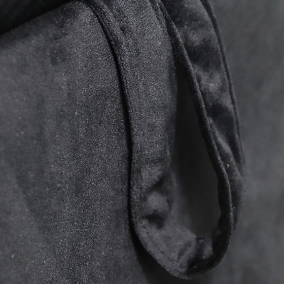 Indoor black velvet chaise lounge with rolled armrest and pillow for comfortable reading and chatting