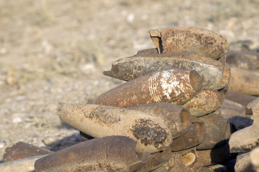 Inert artillery shells are stacked up for collection Canvas Art - Terry MooreStocktrek Images (17 x 12)