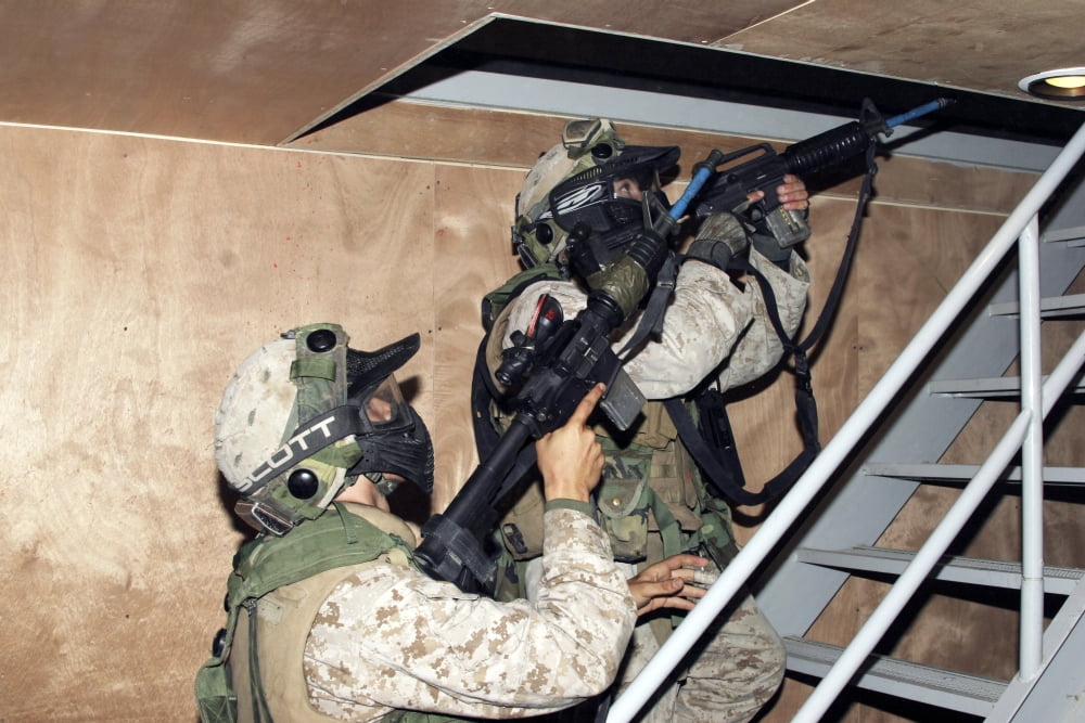 Infantry scouts go up a flight of stairs Canvas Art - Stocktrek Images (34 x 23)