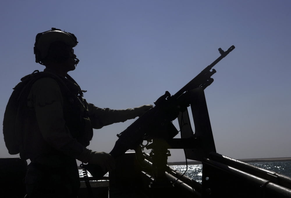 Information Systems Technician manning an M240 machine gun at Lake Quadsiyah near Haditha Iraq Canvas Art - Stocktrek Images (34 x 24)