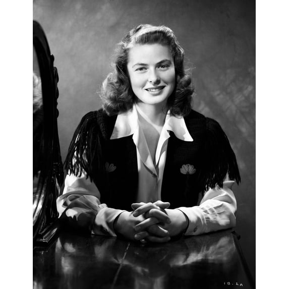 Ingrid Bergman sitting and smiling in a Long Sleeve Dress with a Collar Photo Print (24 x 30)