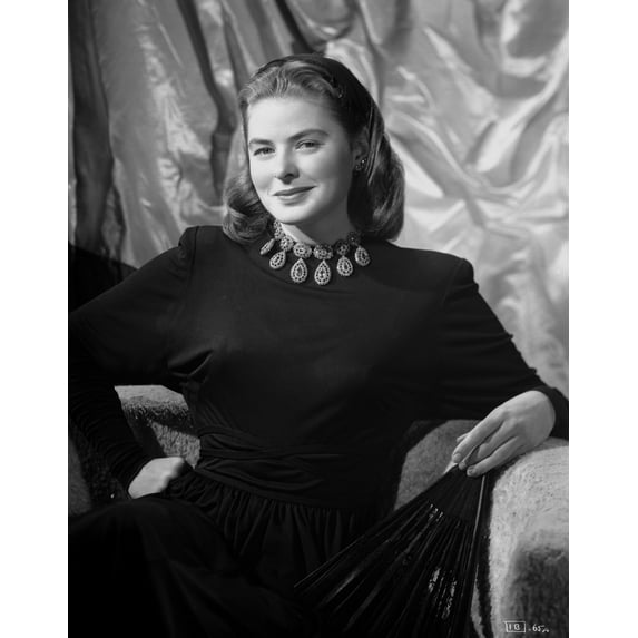 Ingrid Bergman smiling and sitting in a Long Sleeve Blouse Photo Print (24 x 30)