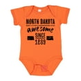 thumbnail image 1 of Inktastic North Dakota Awesome Since 1889 Boys or Girls Baby Bodysuit, 1 of 5