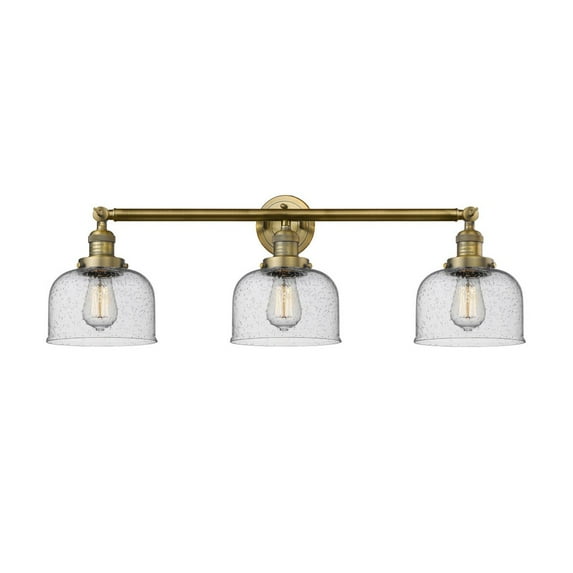 205-BB-G74 Innovations Lighting Bell - 3 Light Bath Vanity In Industrial Style-11 Inches Tall and 32 Inches Wide-Brushed Brass Finish-Seedy Glass