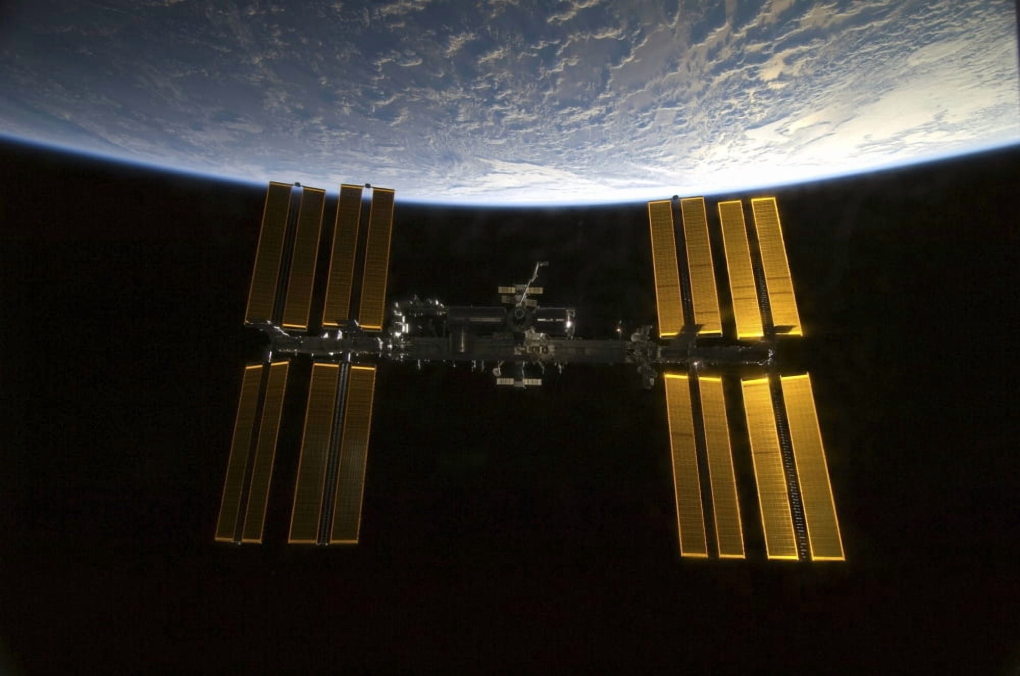 International Space Station backdropped against Earths horizon Canvas Art - Stocktrek Images (34 x 23)