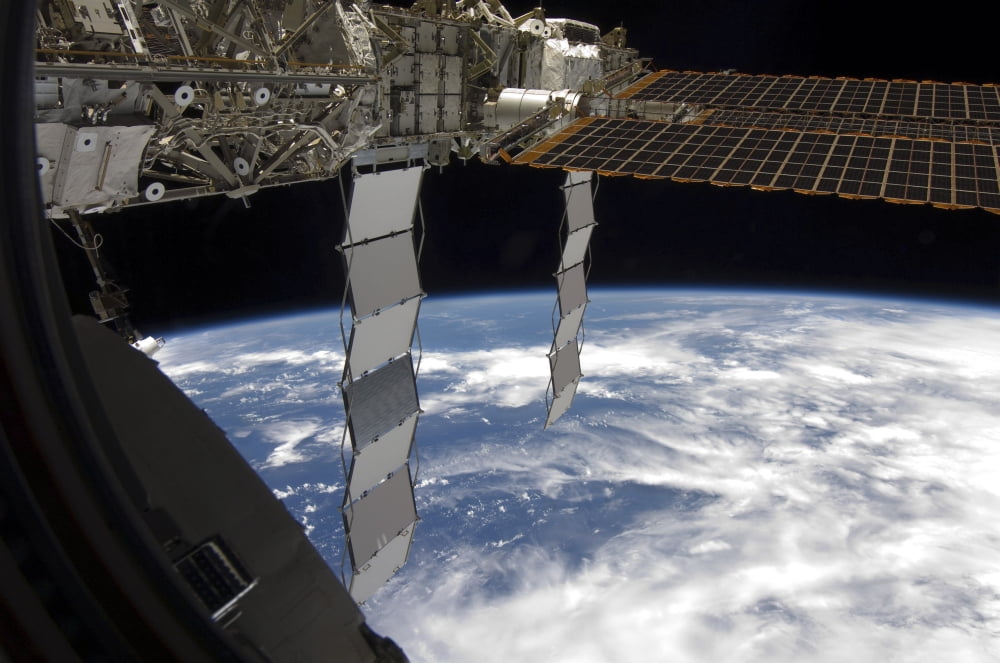 International Space Station backdropped againts a blue and white Earth Canvas Art - Stocktrek Images (34 x 23)