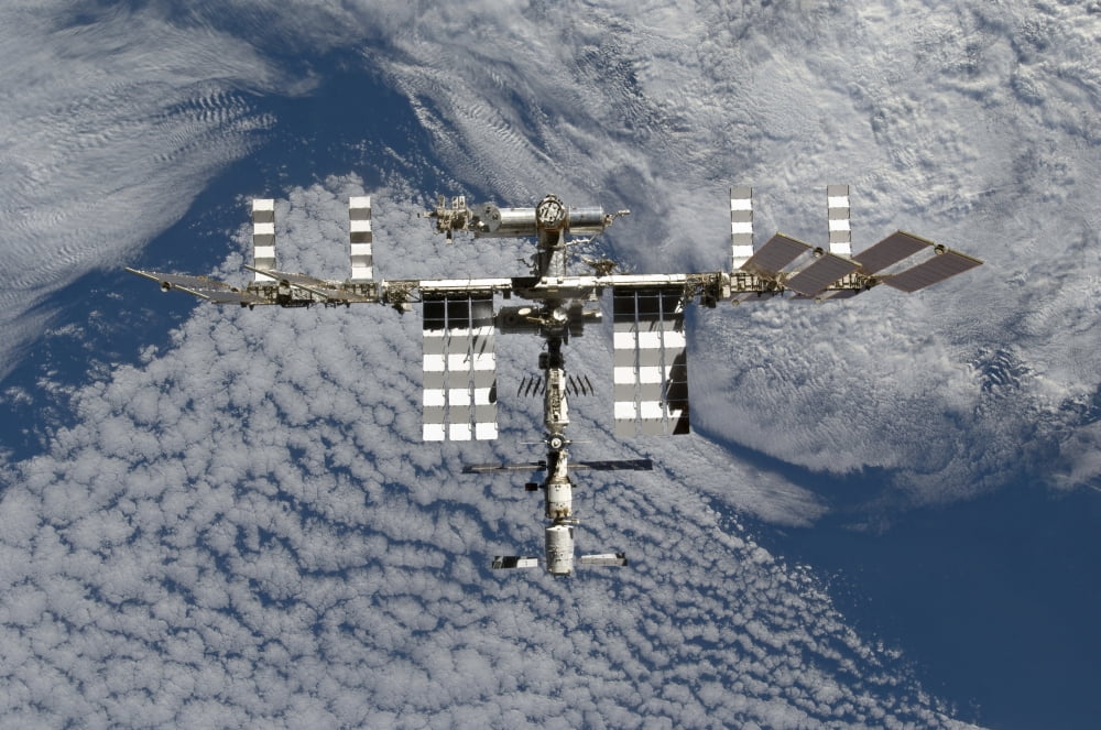 International Space Station backgropped by a blue and white Earth Canvas Art - Stocktrek Images (35 x 23)