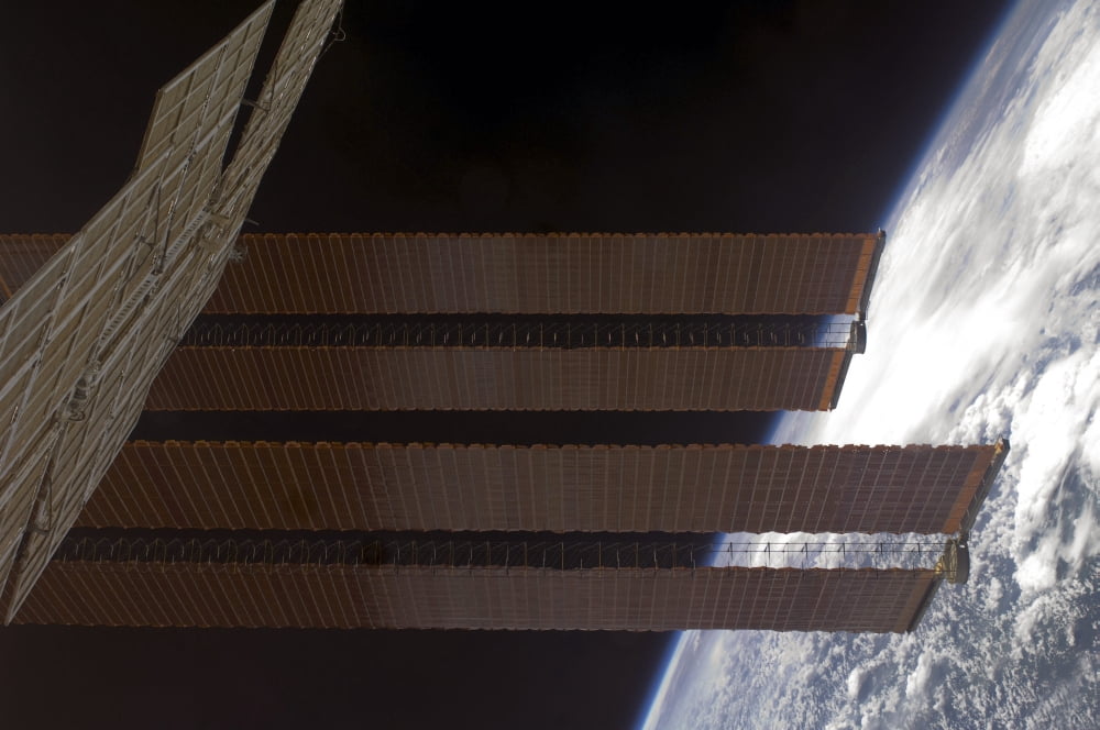 International Space Stations solar array panels and Earths horizon Canvas Art - Stocktrek Images (35 x 23)