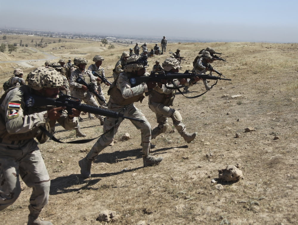 Iraqi Army Soldiers move to positions at the Guzlani Warrior Training Center in Iraq Canvas Art - Stocktrek Images (32 x 25)