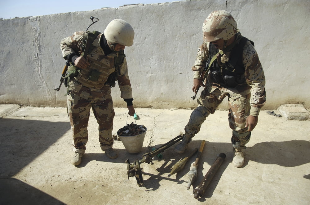 Iraqi army soldiers find a weapons cache Canvas Art - Stocktrek Images (34 x 23)