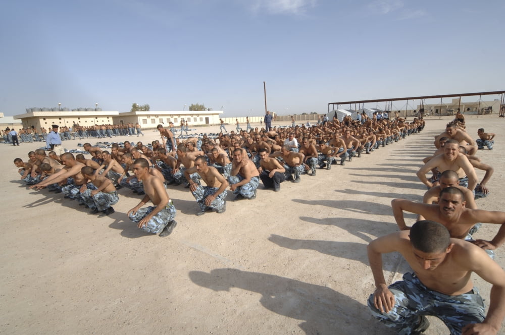 Iraqi police cadets being trained by the British Army and police Canvas Art - Andrew ChittockStocktrek Images (34 x 23)