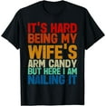 thumbnail image 1 of It's Hard Being My Wife's Arm Candy Here I Am Nailing It T-Shirt, 1 of 4