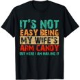 thumbnail image 1 of It's Not Easy Being My Wife's Arm Candy But Here I Am T-Shirt, 1 of 3
