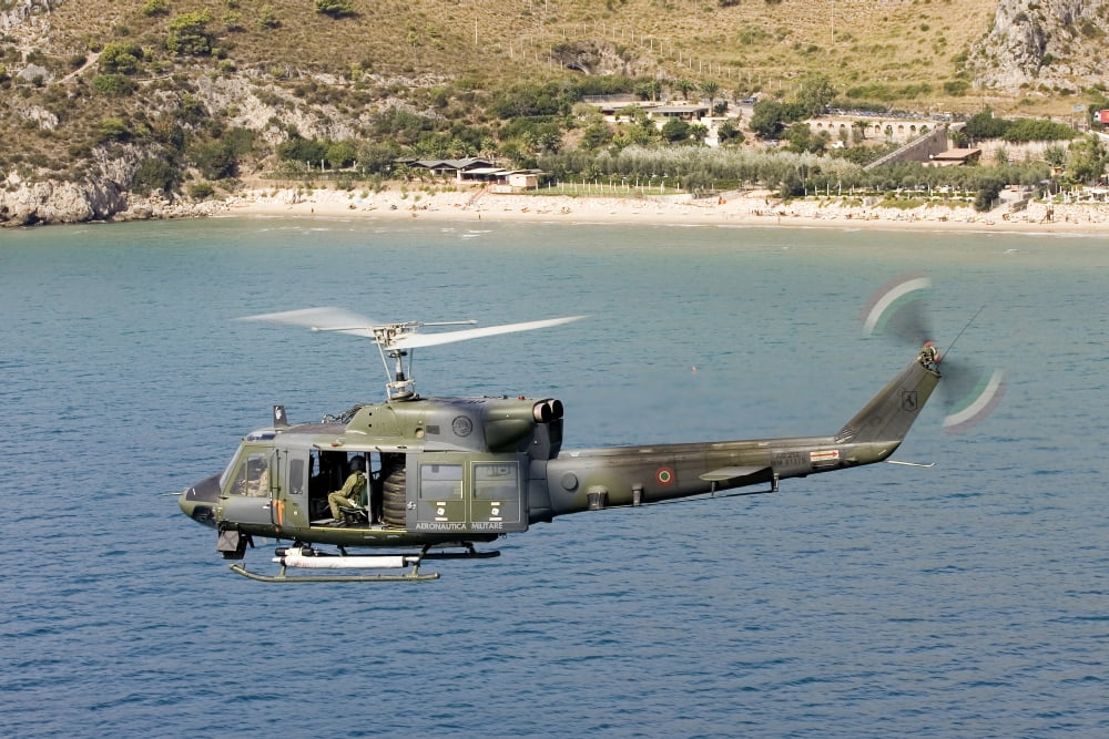 Italian Air Force AB-212 ICO helicopter in flight over Italy Canvas Art - Erik RoelofsStocktrek Images (35 x 23)