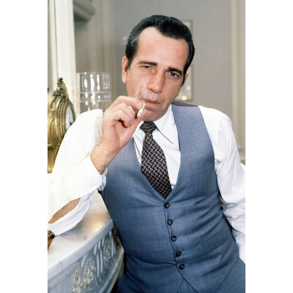 Italian-American character actor Robert Sacchi best known for his resemblance of Humphrey Bogart, close-up, smoking a cigarette at event, 1980s. Photo: Oscar Abolafia (robertsacchi003) Poster Print (8