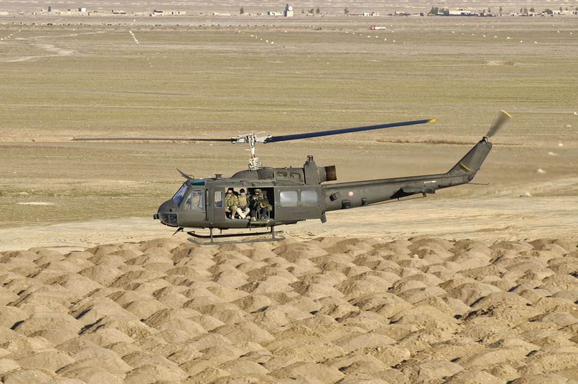 Italian Army AB-205MEP utility helicopter in flight over Shindand Afghanistan Canvas Art - Giovanni CollaStocktrek Images (18 x 12)