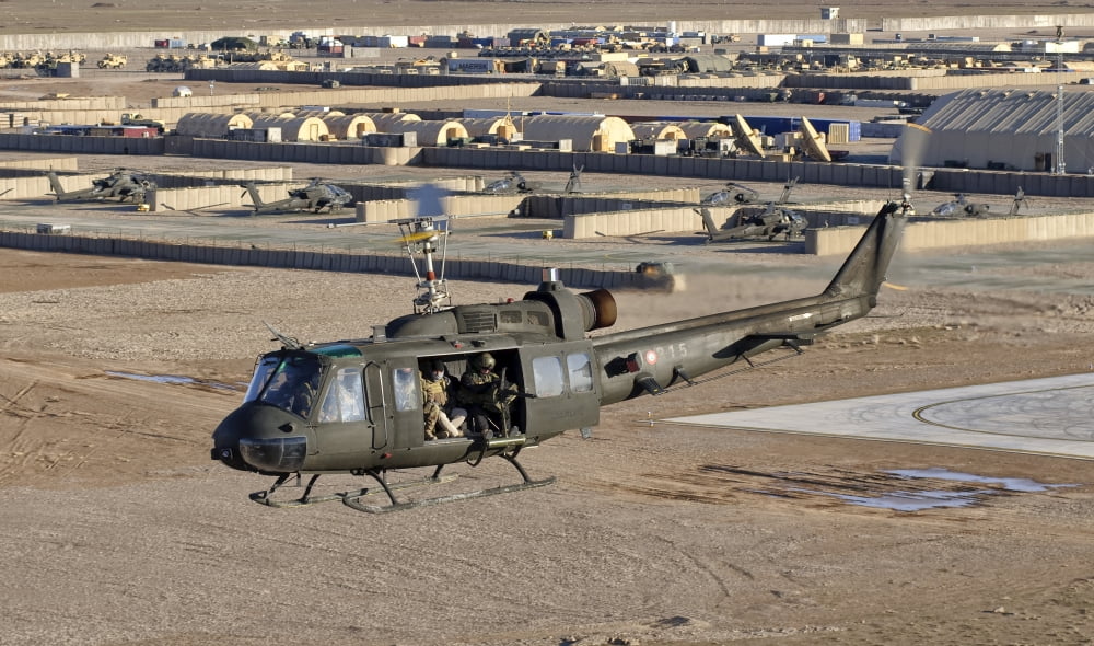 Italian Army AB-205MEP utility helicopter in flight over Shindand Afghanistan Canvas Art - Giovanni CollaStocktrek Images (37 x 22)
