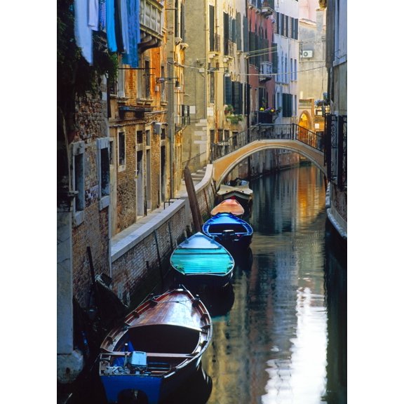 Italy Venice. Gondolas moored in canal. Poster Print by Jaynes Gallery