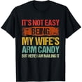 thumbnail image 1 of Its Not Easy Being My Wifes Arm Candy But Here I Am Nailin T-Shirt, 1 of 4