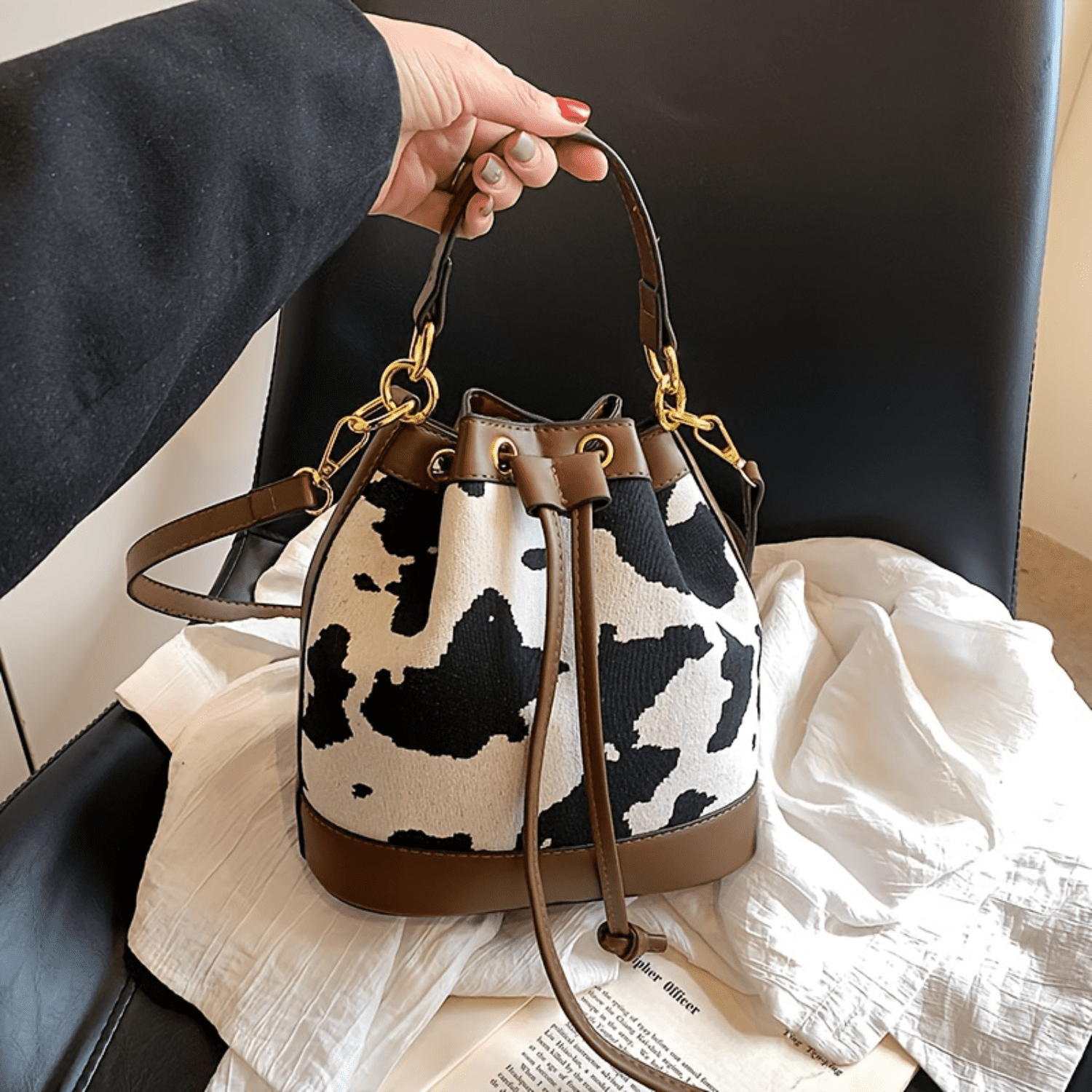 Cow print bucket bag sale