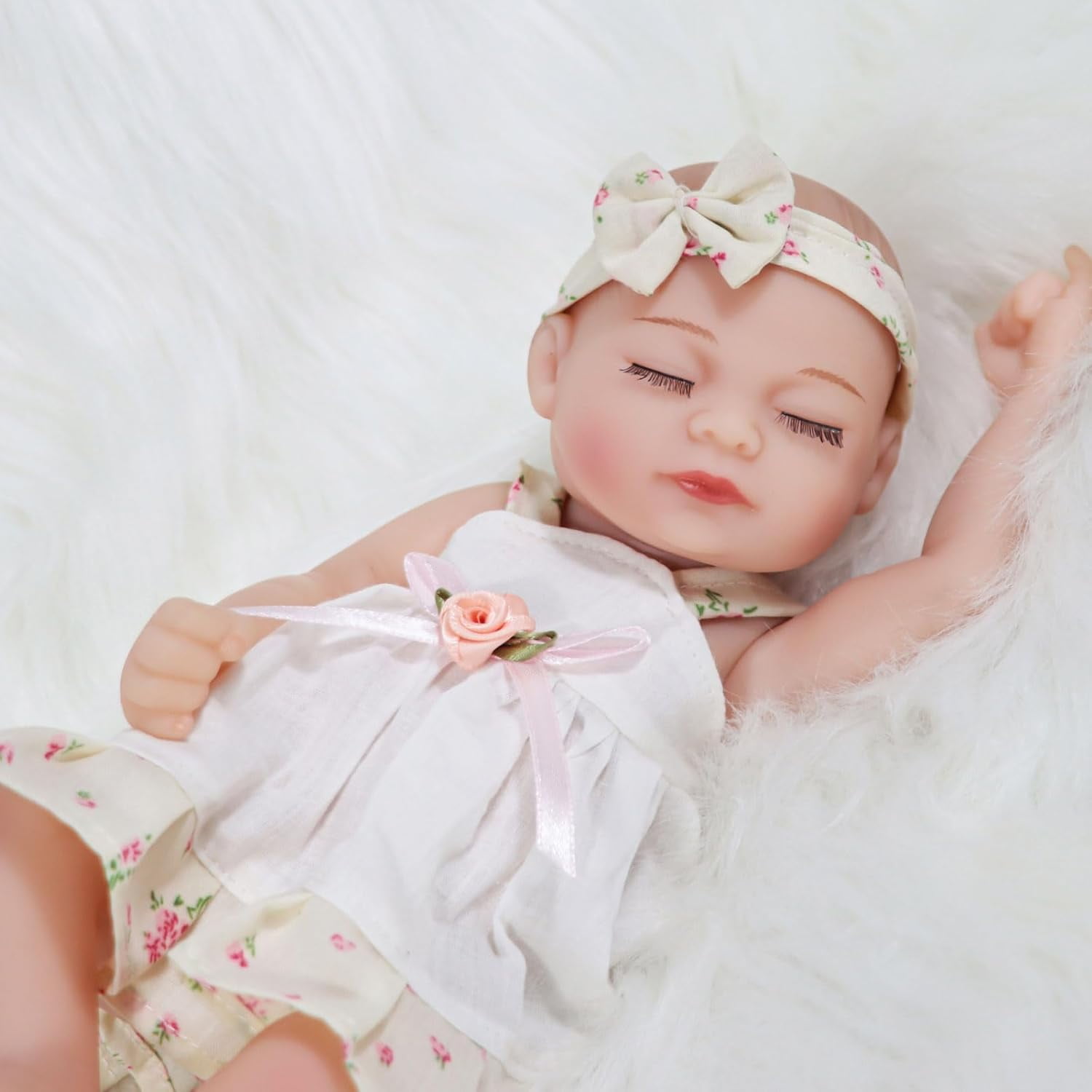 JRLCGYP Realistic Reborn Baby Boy Doll - 10 Inch Soft Vinyl Newborn with Removable Accessories, Perfect Gift for Kids Ages 3+, Handcrafted Lifelike Baby Doll with Dress and Headband