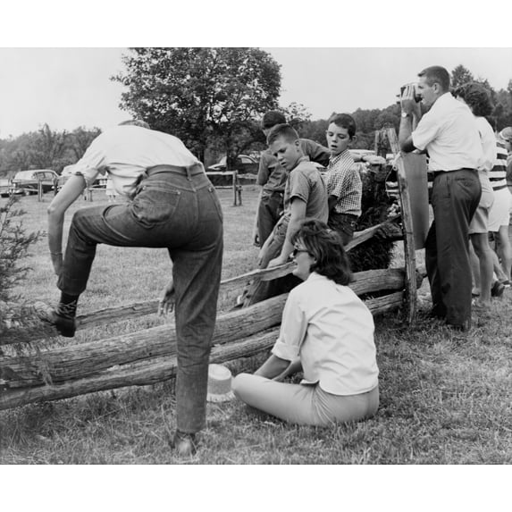 Jacqueline Kennedy Seated On The Ground At The Apple Barrel Pony Rally In Halfway History (24 x 18)
