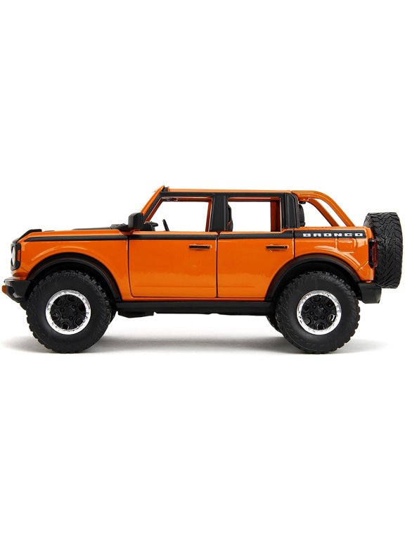 2021 Ford Bronco Open-Top Orange with Black Stripes and Hood with Extra Wheels "Just Trucks" Series 1/24 Diecast Model Car by Jada