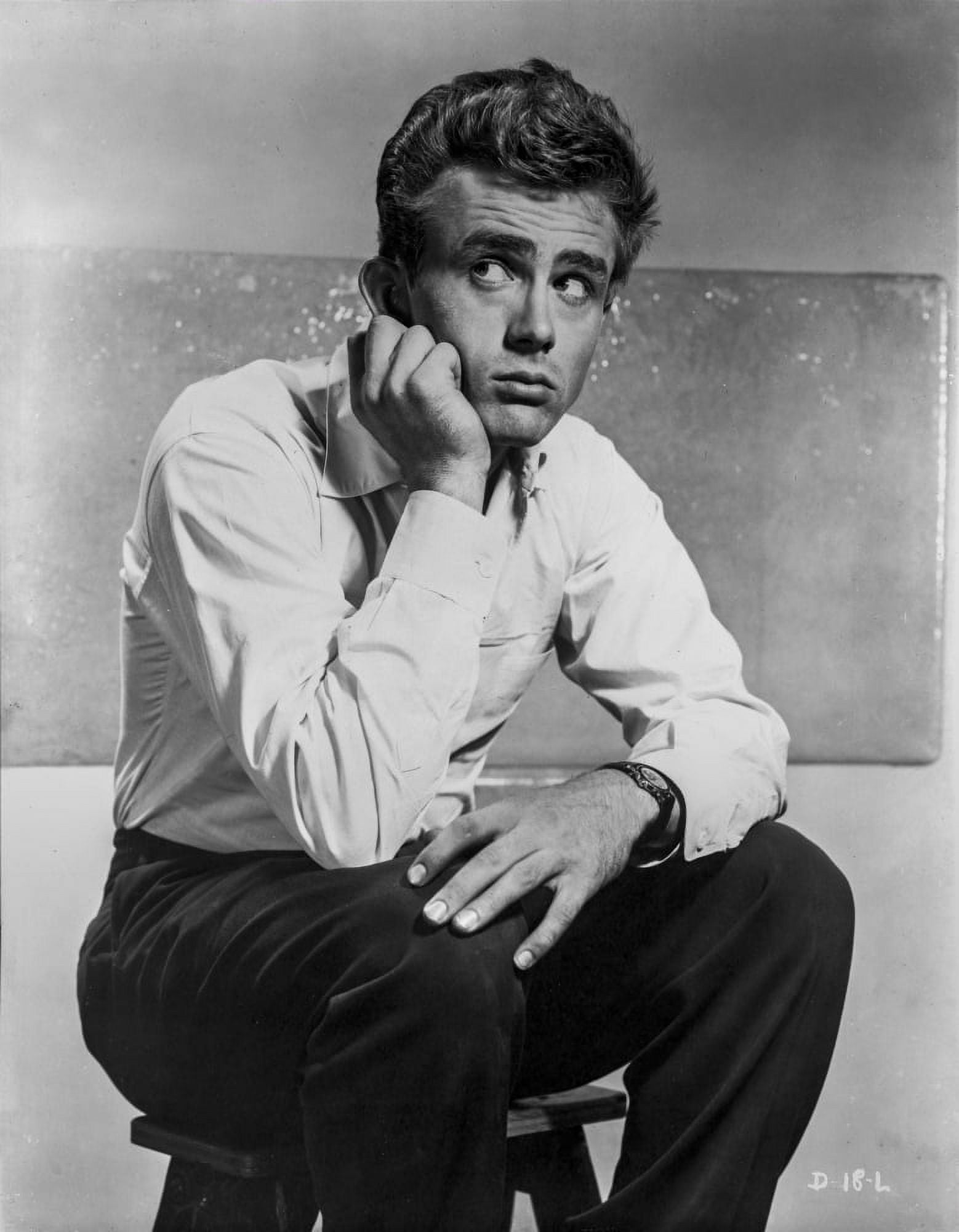 James Dean Seated on a Chair in White Long Sleeve Collar Shirt and Black Linen Pants with Knees Bent and Head Leaning on the Hand Photo Print 8 x 10