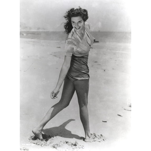 Jane Russell Posed in Silk Short Sleeve Shirt and Shorts while Walking on the Beach Sand Photo Print (24 x 30)