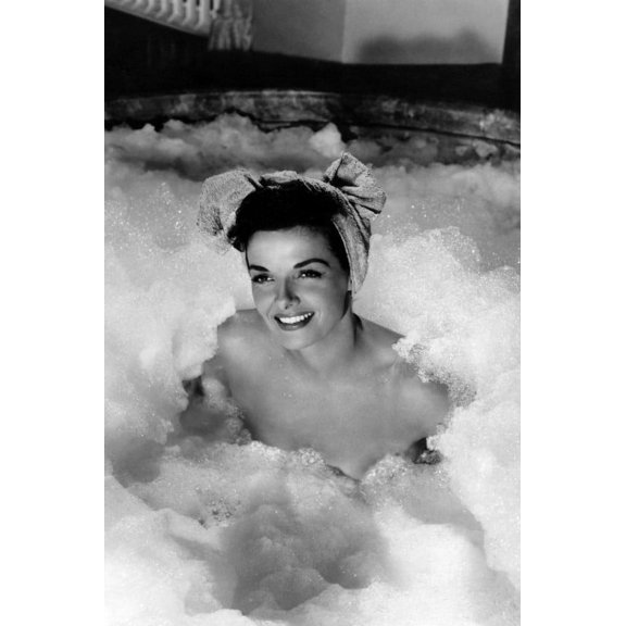Jane Russell in The French Line hair tied sitting in bubbles smiling 24x36 Poster