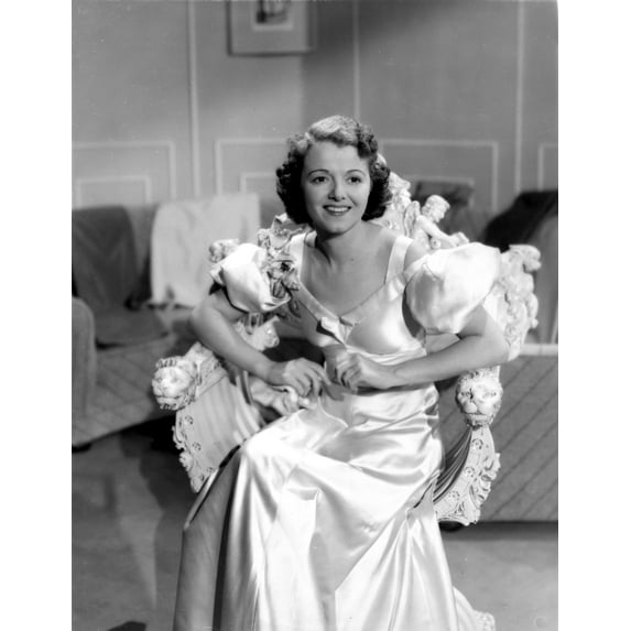 Janet Gaynor on a Silk Gown sitting Photo Print (8 x 10)