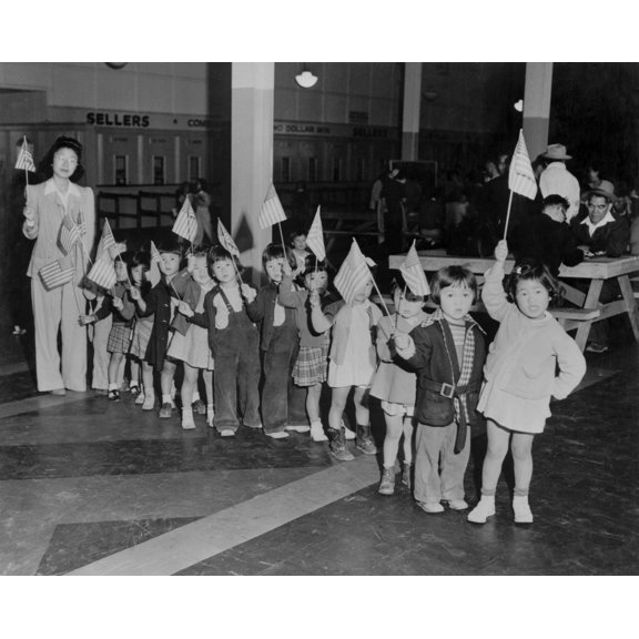 Japanese-American Youngsters Carry Flags In Americanization Program At The Santa Anita Assembly Center. Internees Lived At The Former Santa Anita Race Track For Several Weeks Before They Were Removed