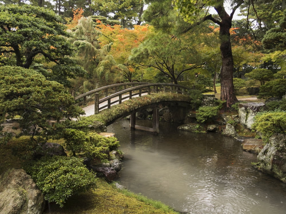 Japanese stone bridge across a stream in a park Kyoto Japan Canvas Art - Philippe Widling Design Pics (17 x 13)