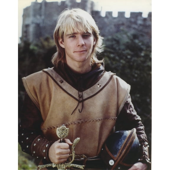 Jason Connery as Young Merlin in Merlin TV Movie in Dirty White Sleeveless Tunic and Black Leather Double with Right Hand Holding a Broad Sword Photo Print (24 x 30)