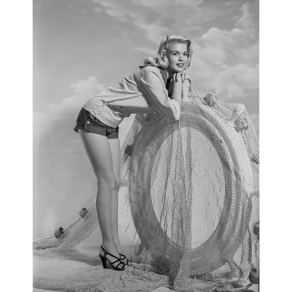 Jayne Mansfield Posed and Bent Over in White Long Sleeve Shirt and Black Short Skirt with Hands Together while Head Leaning on Hand Photo Print (24 x 30)