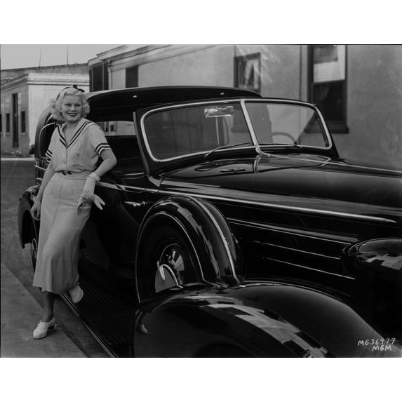 Jean Harlow Posed while Leaning Back on a Black Car in White Short Sleeve Dress with Black Outline on the Collared and Sleeve Photo Print (24 x 30)