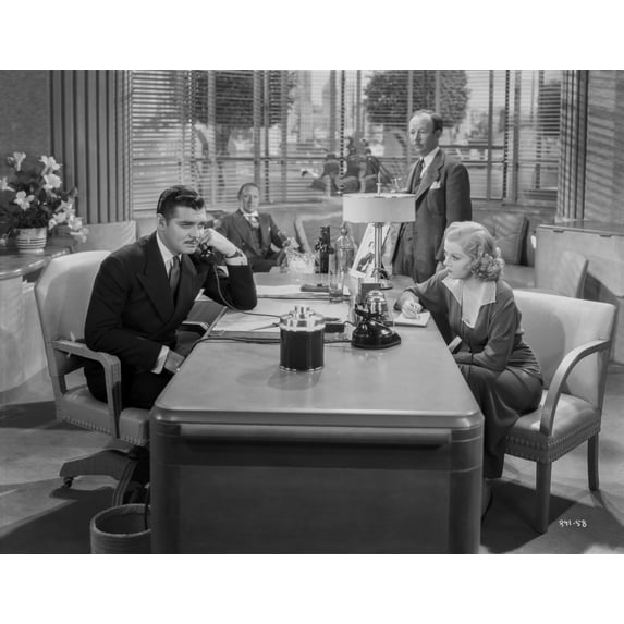 Jean Harlow Scene from a Film sitting In front of the Table in Black Long Sleeve Dress with Right Arm on the Table Photo Print (24 x 30)