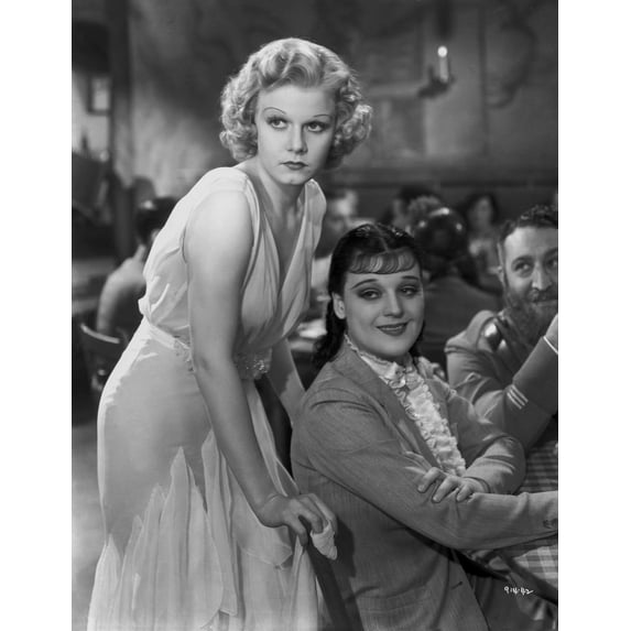 Jean Harlow Scene from a Film standing while Leaning Forward in White Silk Dress Photo Print (24 x 30)