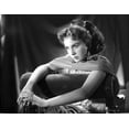 thumbnail image 1 of Jean Simmons Posed and sitting on the Couch in White Pleated Dress and Silk Scarf with Hands Together Photo Print (24 x 30), 1 of 1