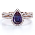 thumbnail image 1 of JeenMata 1.5 Carat Pear Cut Lab Created Alexandrite and Moissanite Halo Wedding Ring Set - Infinity Twist Band in 18k Rose Gold over Silver, 1 of 4
