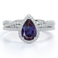 thumbnail image 1 of JeenMata 1.5 Carat Pear Cut Lab Created Alexandrite and Moissanite Halo Wedding Ring Set - Infinity Twist Band in 18k White Gold over Silver, 1 of 3