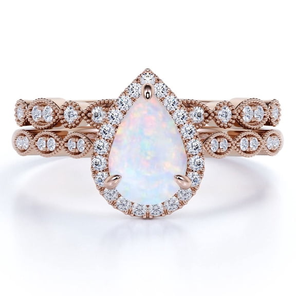 JeenMata 1.50 Carat Pear Cut Blue Opal and Moissanite Engagement Ring Set in 18K Rose Gold over Silver