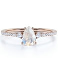 thumbnail image 1 of JeenMata 1.75 Carat Pear Shaped Rainbow Moonstone and Moissanite Birthstone Ring in 18k Rose Gold over Silver, 1 of 6