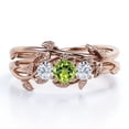 thumbnail image 1 of JeenMata 1 TCW Round Shaped Lab Created Peridot and Moissanite - Inspired by Nature - Trilogy Bridal Ring Set - 18K Rose Gold Plating over Silver, 1 of 6